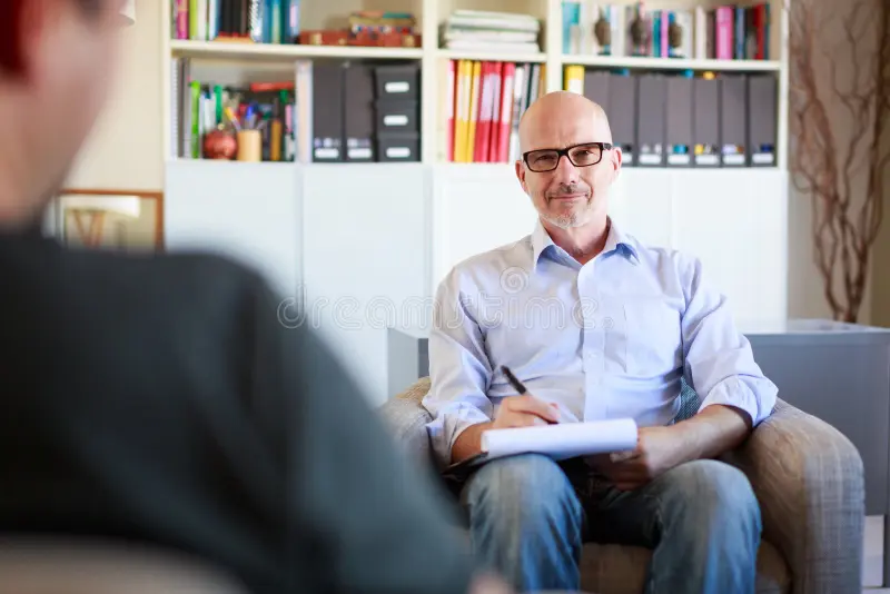 therapy-session-adult-men-talking-to-his-psychotherapist-man-106506088